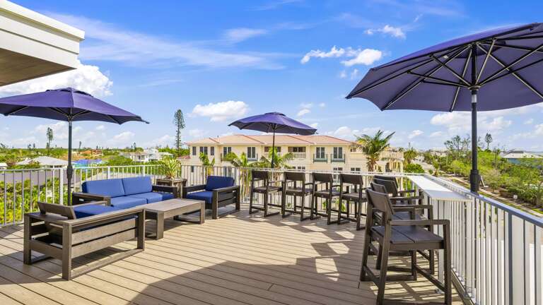 Daytime - Rooftop - Lounge Area - High-Top Chairs - City Views