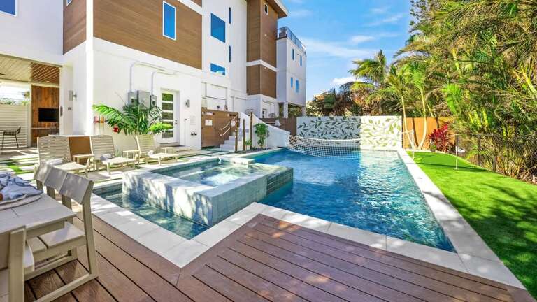 Vacation Rental With Verdant Garden, Wooden Deck, And Pristine Pool