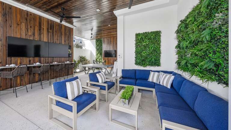 Daytime - Covered Pool Area - 3 HD TVs - Outdoor Dining - BBQ Grill - Ping Pong - and Lounge Area