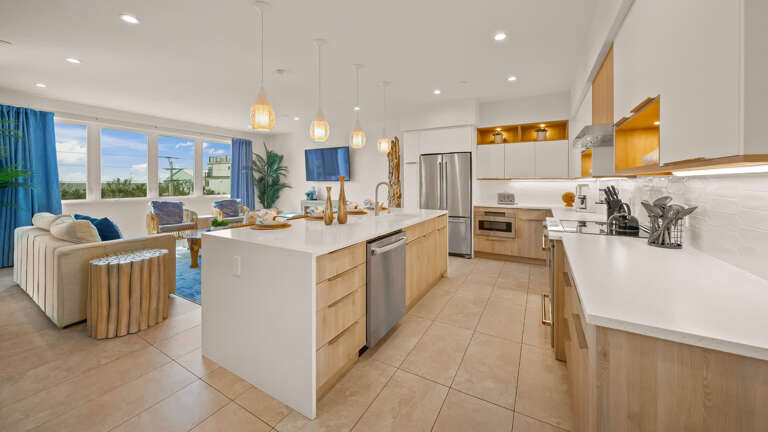 Spacious Kitchen Merging With Living Area, Large Windows, Sleek Surfaces
