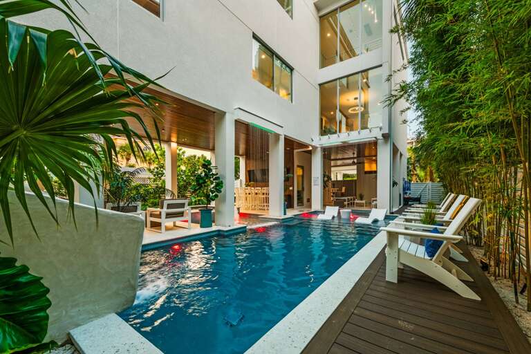 Twilight - Rear Elevation - Resort Style Pool W/ Waterslide - Covered Pool Area Twilight - Rear Elevation - Resort Style Pool W/ Waterslide - Covered Pool Area