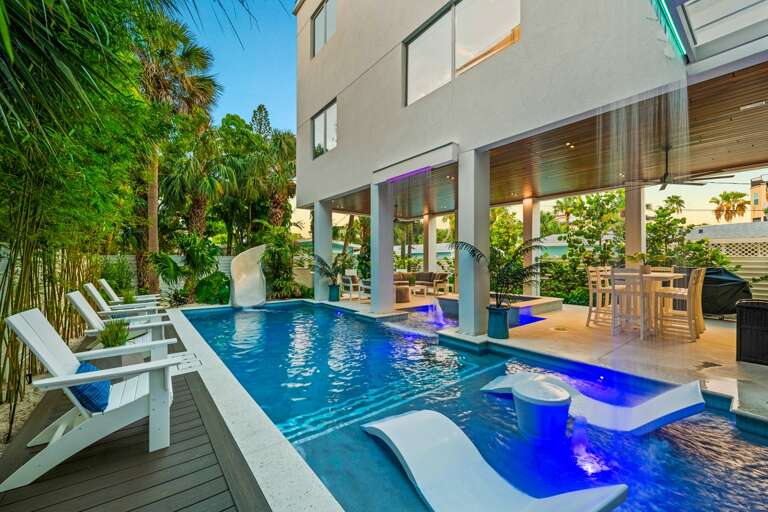 Twilight - Covered Pool Area - Resort Style Pool - Featuring a Waterslide, Spa,  (2)Rain Curtains and (2)Splash/Sunshelfs Twilight - Covered Pool Area - Resort Style Pool - Featuring a Waterslide, Spa,  (2)Rain Curtains and (2)Splash/Sunshelfs