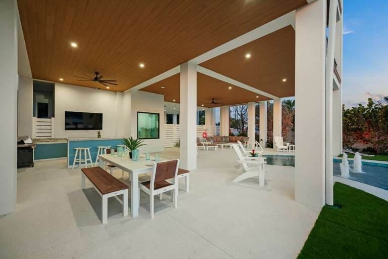Covered Pool Area - Bar and Dining seating w/ Large HDTV
