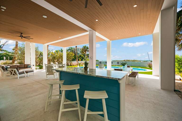 Covered Pool Area - Bar and Dining seating w/ Large HDTV