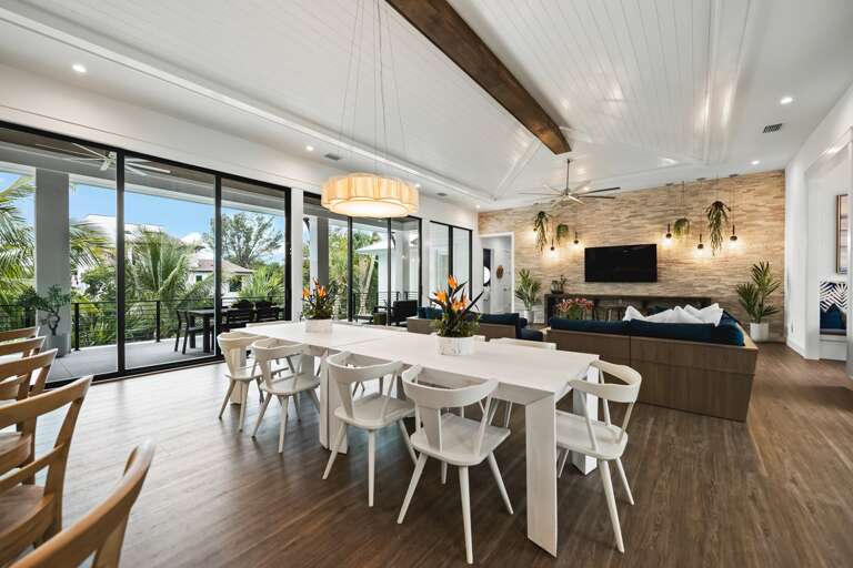 Great Room - Open Floor Plan - Fully Stocked Kitchen, Dining for 10 and Bar seating for 5 - Balcony Access - Lake Views.