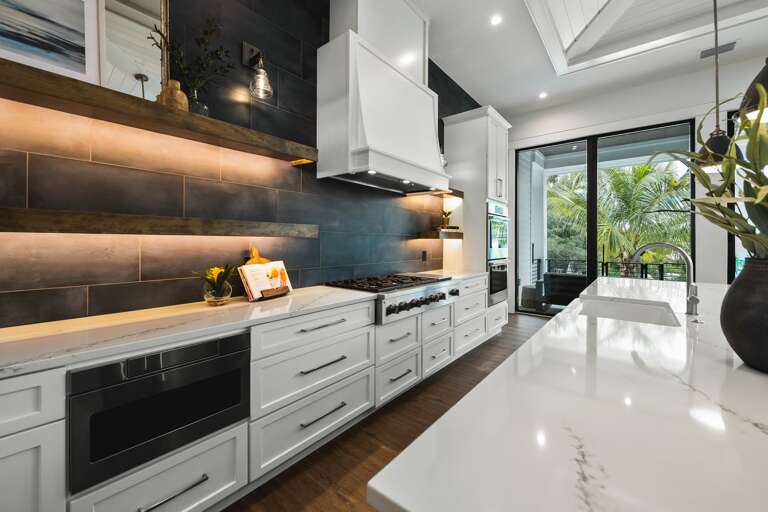 Kitchen - Oversized Refrigerator - (2) Dishwashers, Double Ovens, & Large Gas Stove - Balcony Access.