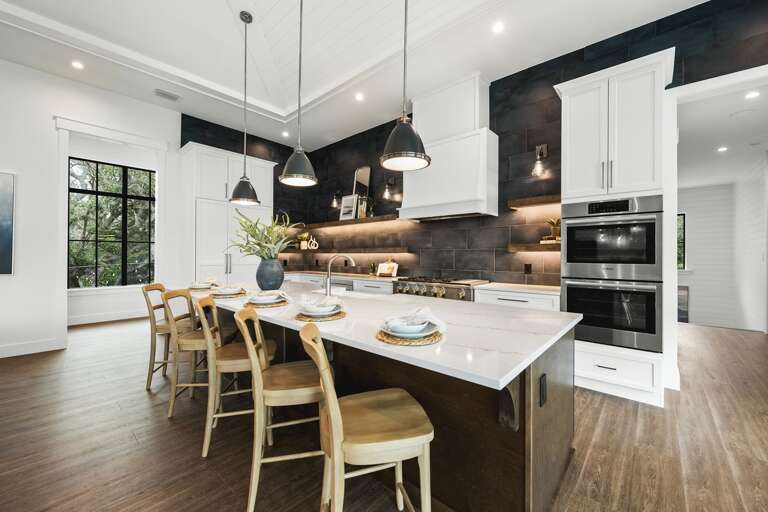 Kitchen - Oversized Refrigerator - (2) Dishwashers, Double Ovens, & Large Gas Stove - Balcony Access.