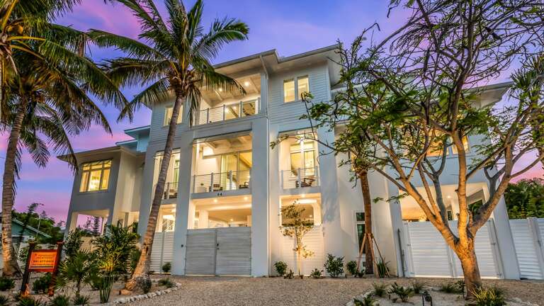 Twilight - Front Elevation - Sandbar Social - Sleeps 18 - Step to the Beach Twilight - Front Elevation - Sandbar Social - Sleeps 18 - Step to the Beach