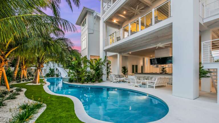 Twilight - Rear Elevation - Covered Pool Area - Large Horseshoe Bar w/ 4 Large HDTV's Twilight - Rear Elevation - Covered Pool Area - Large Horseshoe Bar w/ 4 Large HDTV's