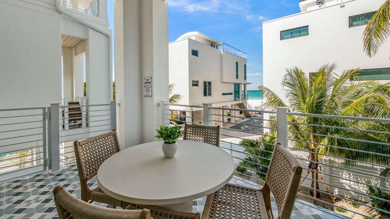 Daytime - 1st Living Level - Rear Balcony - Gulf and Pool Views - Seating for 12 Daytime - 1st Living Level - Rear Balcony - Gulf and Pool Views - Seating for 12