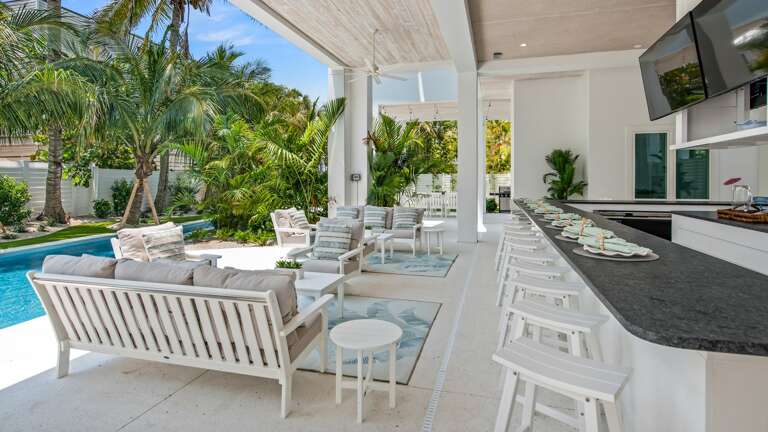 Covered Pool Area - Soft Seating, Exterior Dining Space and Bar seating Covered Pool Area - Soft Seating, Exterior Dining Space and Bar seating