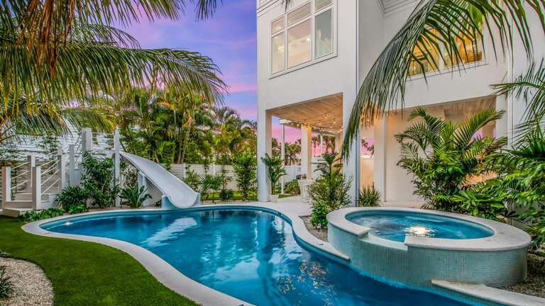 Twilight - Rear Elevation - Sandbar Social - Covered Pool Area - Resort Style Pool w/ Spa and Slide Twilight - Rear Elevation - Sandbar Social - Covered Pool Area - Resort Style Pool w/ Spa and Slide