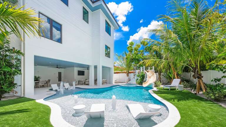 Resort Style Pool w/ Water Slide and Heated Spa Resort Style Pool w/ Water Slide and Heated Spa