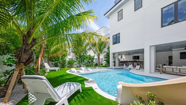 Resort Style Pool w/ Water Slide and Sun Shelf Resort Style Pool w/ Water Slide and Sun Shelf