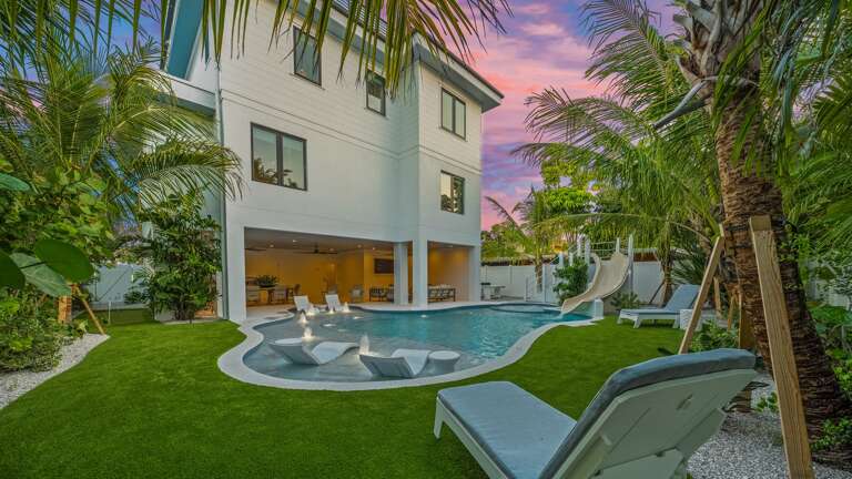 Twilight - Resort Style Pool - Lush Tropical Landscaping - and Mini Golf Twilight - Resort Style Pool - Lush Tropical Landscaping - and Mini Golf