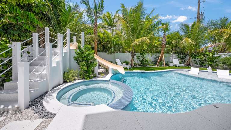 Resort Style Pool w/ Water Slide and Heated Spa Resort Style Pool w/ Water Slide and Heated Spa