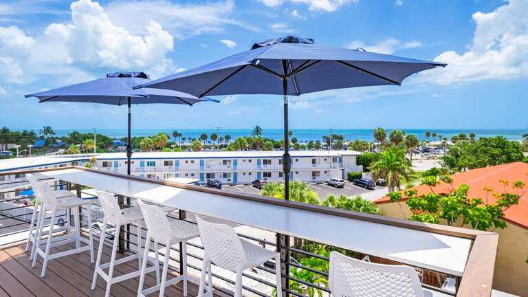 Daytime - Rooftop Deck - High-Top Bar Seating - Gulf Views Daytime - Rooftop Deck - High-Top Bar Seating - Gulf Views