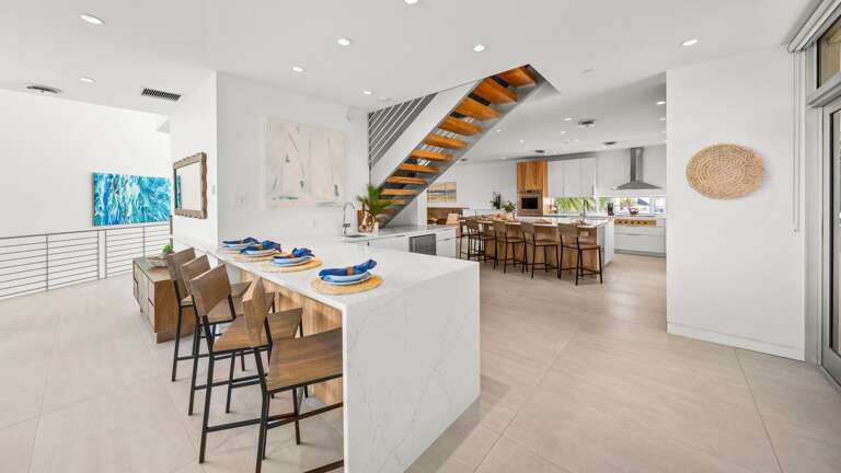 Great Room - Bar Seating for 12  - Electric Fireplace - Large Smart TV - Balcony Access - Waterfront - Direct Gulf Views