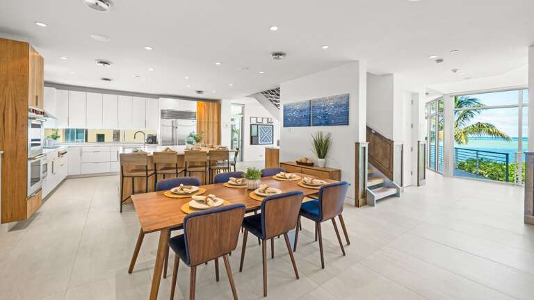 Great Room - Open Floor Plan - Fully Stocked Kitchen, Dining for 8 and Bar seating for 8 - Balcony Access - Gulf Views