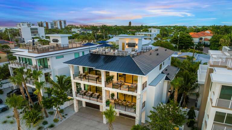 Twilight - Aerial Drone - Front Elevation - Ocean Breeze Twilight - Aerial Drone - Front Elevation - Ocean Breeze