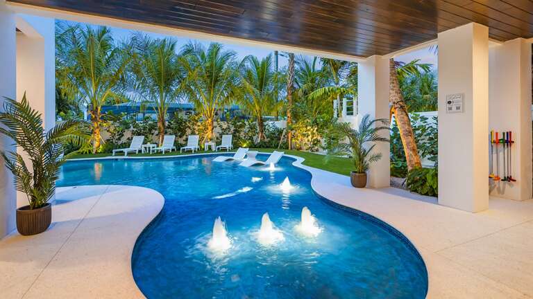 Twilight - Covered Pool Area - Beach Entry Resort Style Pool Twilight - Covered Pool Area - Beach Entry Resort Style Pool