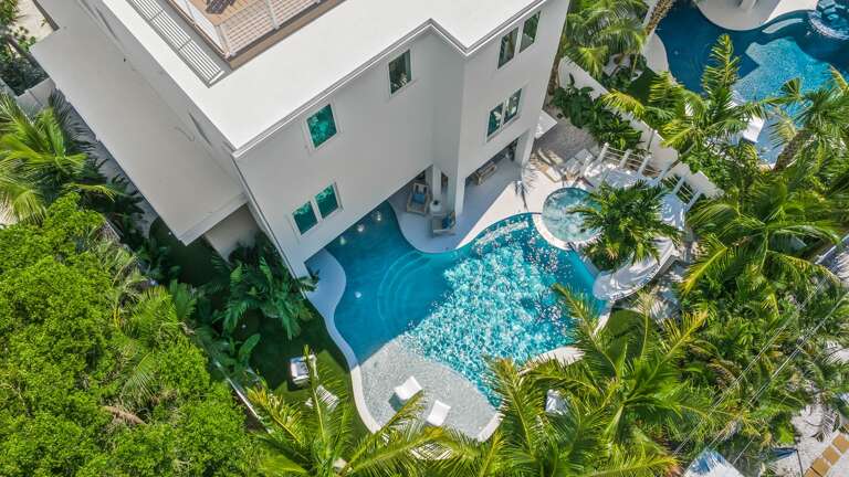 Daytime - Aerial - Resort Style Pool w/ Water Slide and Heated Spa