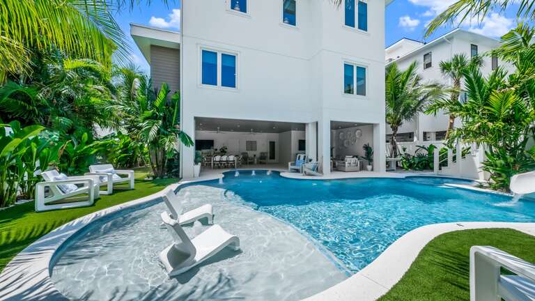 Resort Style Pool - Tropical Landscaping - Sun Shelf - and Putt Putt Golf