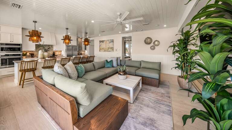 Great Room - Open Floor Plan - Fully Stocked Kitchen, Dining for 8 and Bar seating for 5 - Balcony Access