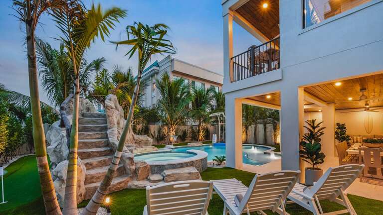 Palm Trees, Poolside, Patio, And Lounge Chairs