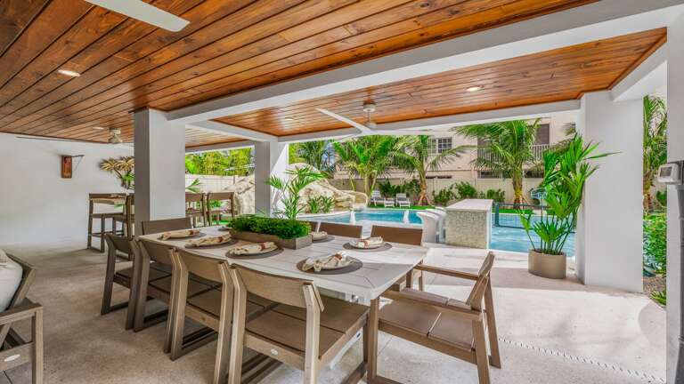 Covered Pool Area - Outdoor Dining Table - (3) Large HDTV's Covered Pool Area - Outdoor Dining Table - (3) Large HDTV's