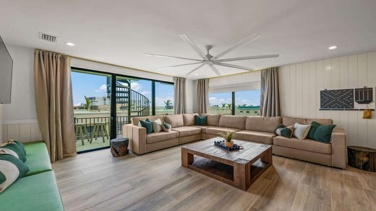 Spacious Sunlit Room, Large Sectional, Sliding Glass, Wooden Floors