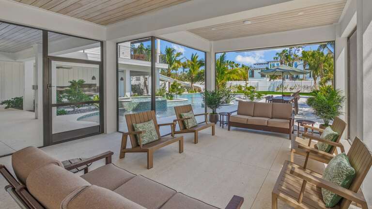 Enclosed Lounge Area - Soft Seating - Dining Area for 12 - Large HDTV