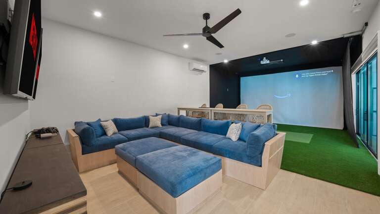 Media Centre - Features 2-Large HDTV's Soft Seating, Bartop Seating and Sports Simulator