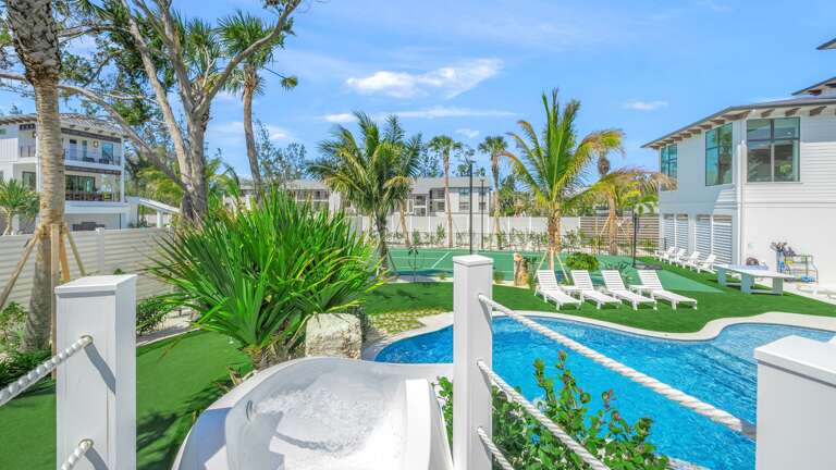 Covered Pool Area - Resort Style Pool w/ Waterslide and Oversized Spa - Sport Court & Mini Golf