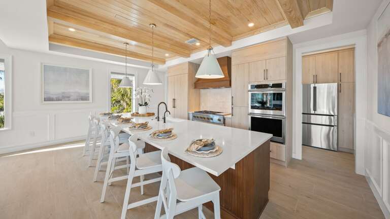 Great Room - Open Floor Plan - Fully Stocked Kitchen, Dining for 16 and Bar seating for 6 - Balcony Access