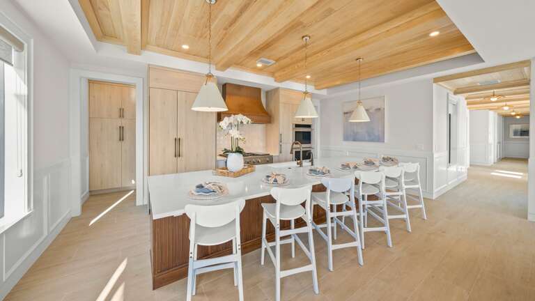 Great Room - Open Floor Plan - Fully Stocked Kitchen, Dining for 16 and Bar seating for 6 - Balcony Access