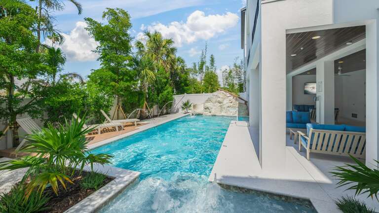 Daytime - Resort Style Pool & Spa - Waterslide - Pool Basketball - Lounge Chairs