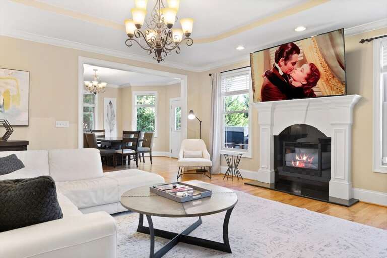 Enjoy the atmospheric glow of the Living Room's gas fireplace while logged into your favorite streaming apps on a 65” Roku HDTV.