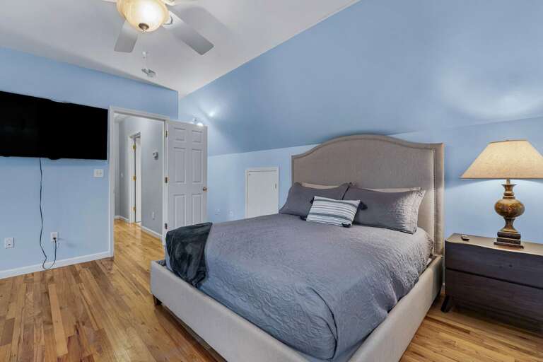 The 2nd upstairs bedroom features a full bed, twin bed and a 55” Roku HDTV. Enjoy a spacious closet!