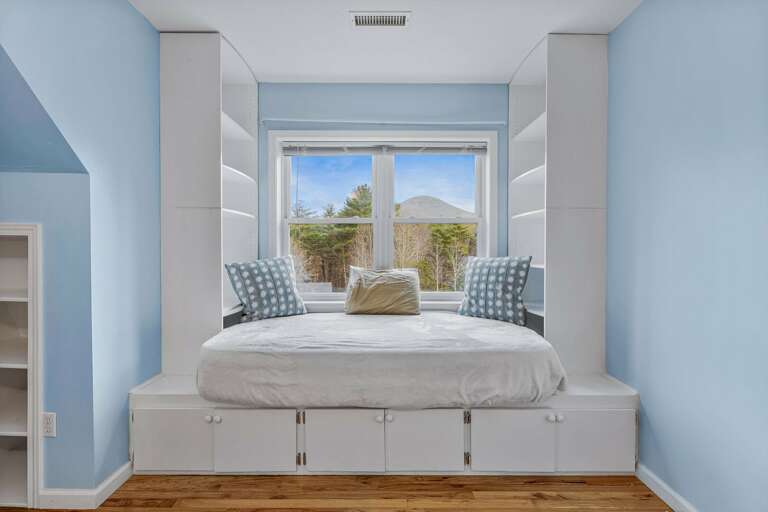 Catch a glimpse of the Blue Ridge Mountains from the upstairs bedrooms! See beautiful foliage during the fall season. Cozy up with a book on the twin bed, which can double as a reading nook.