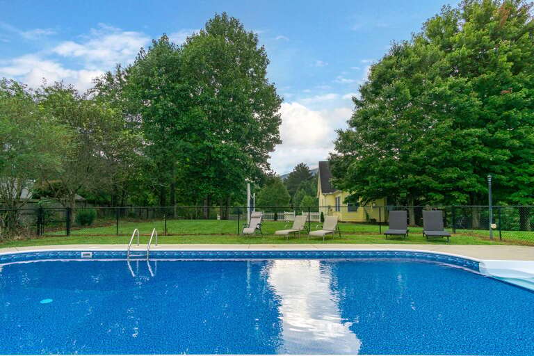 The pool deck features lounge chairs for your relaxation. Pool & hot tub towels available.