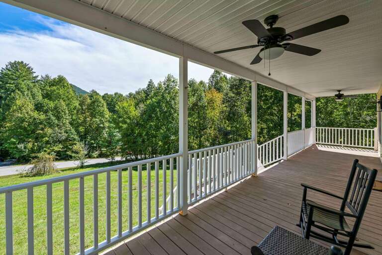 Rain or shine, you can enjoy fresh air on the covered front porch.