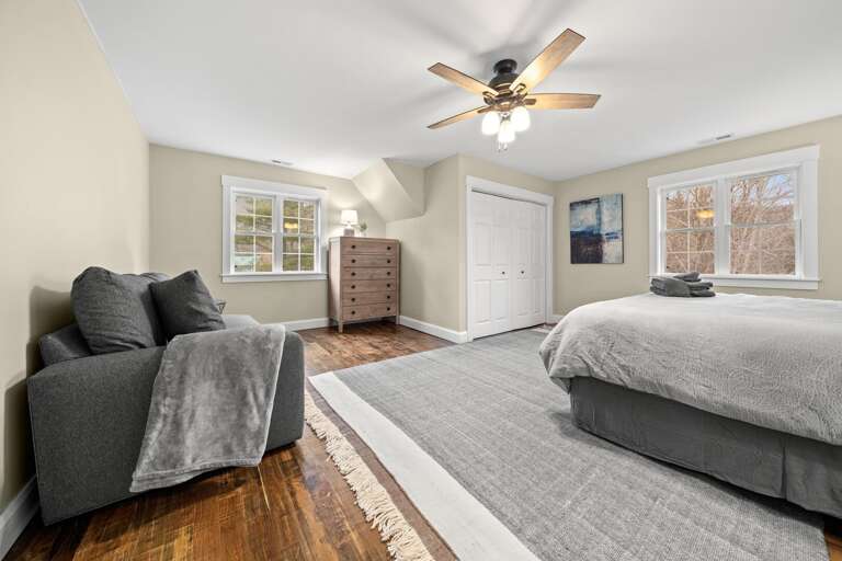 This bedroom contains a sofa, perfect for reading quietly in your room or to accommodate an extra guest on its pull-out bed.