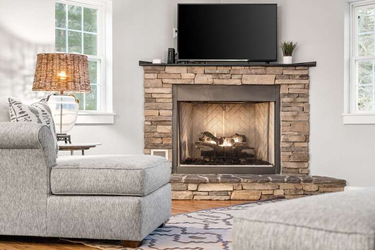 Cozy up with a book and a hot cup of tea or coffee next to the gas fireplace in the Living Room.