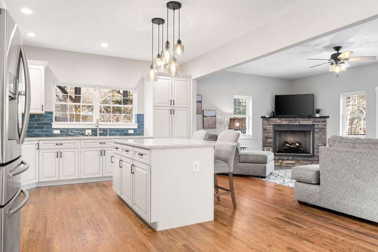 Your family will love the experience of this open layout where the kitchen meets the dining room. Never miss a joke or story!