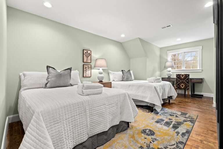 The workspace is located in this bedroom, making it comfortable and easy to check emails or take care of business.