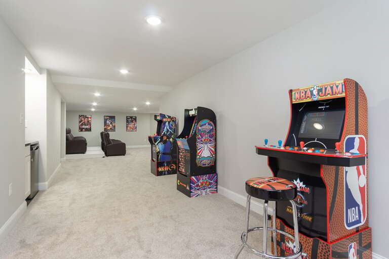 In addition to a pool table, upright checker board and cornhole, the game room has 3 arcade machines: Pacman, Mortal Kombat II & NBA Jam.
