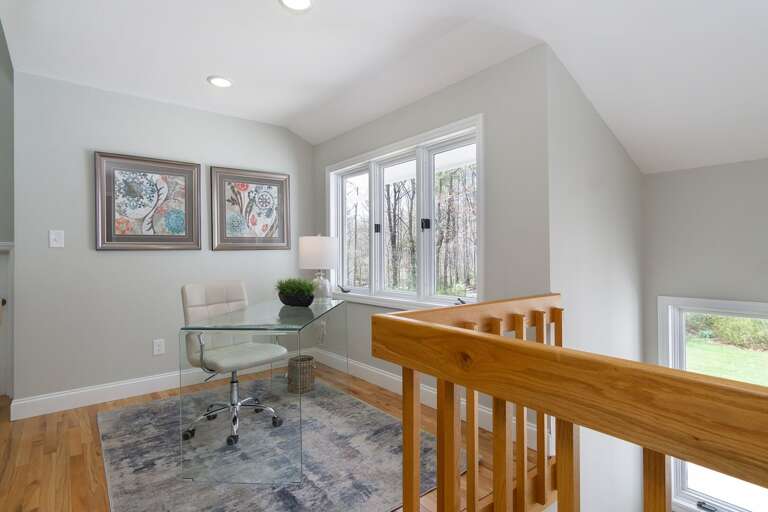 You'll love this workspace with its high-end desk and view! It's located off the primary bedroom, overlooking the living room.