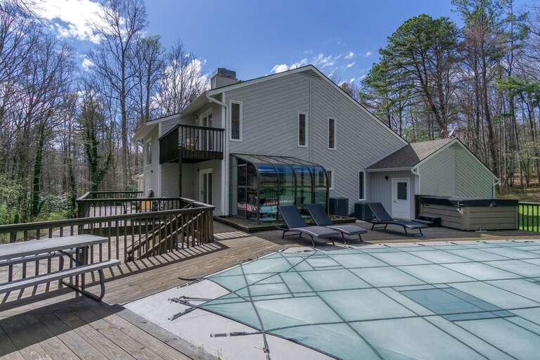 With multiple seating options and ample space for sunbathing, your whole group will love this fenced-in pool deck.