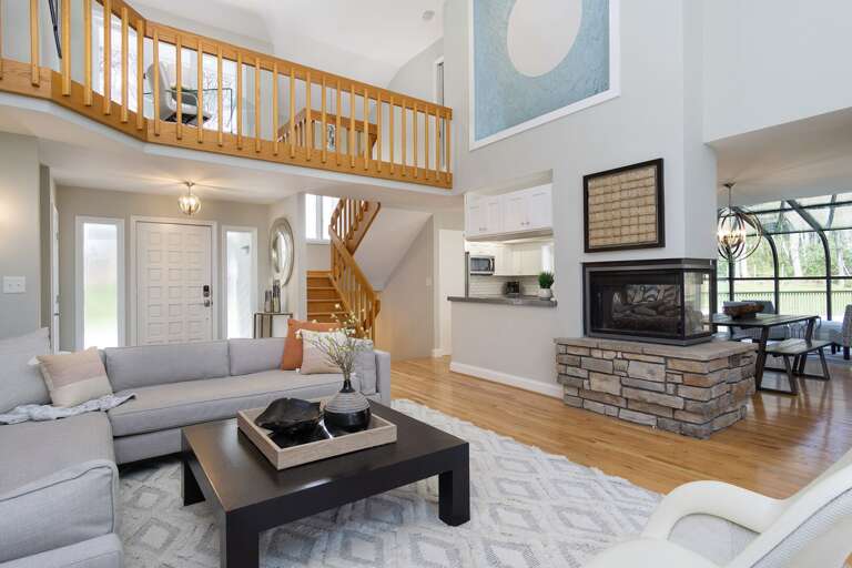 Relax in style with a peninsula gas fireplace and a couch that everyone adores!